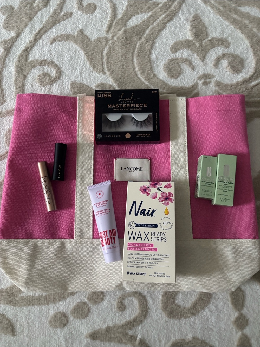 Lancôme Pink Canvas Tote Bag with beauty products